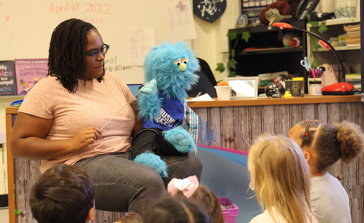Counselor at Brushy Creek Elementary using puppet to teach a class